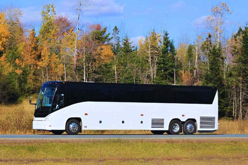 Charter Bus is traveling on a road out of city